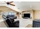 Spacious bonus room featuring comfortable seating, a fireplace, and entertainment area at 5895 E Conservation Dr, Frederick, CO 80504