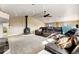 Expansive bonus room with a cozy fireplace, comfortable sectional sofa, and lots of space at 5895 E Conservation Dr, Frederick, CO 80504