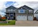 Charming home with a three-car garage and stone accents at 5895 E Conservation Dr, Frederick, CO 80504