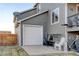 Exterior view of the garage and patio area at 5895 E Conservation Dr, Frederick, CO 80504