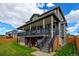Two-story home with covered deck, spacious yard, and lower level storage at 5895 E Conservation Dr, Frederick, CO 80504