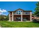Expansive backyard view showcasing a large, inviting lawn and a multi-level deck perfect for outdoor entertaining at 16442 Rocky Point Ln, Morrison, CO 80465