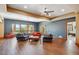 Spacious living room with hardwood floors, large windows with natural light, and neutral paint at 16442 Rocky Point Ln, Morrison, CO 80465