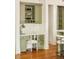Conveniently-situated desk area adjacent to kitchen with custom cabinets and countertop at 958 S Columbine St, Denver, CO 80209
