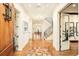 Grand foyer showcasing hardwood floors, staircase, and views into the dining room at 958 S Columbine St, Denver, CO 80209