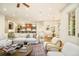 Spacious living room with open floor plan and view of the kitchen and dining area, perfect for entertaining at 958 S Columbine St, Denver, CO 80209