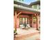 Covered patio with brickwork, comfortable seating, and view of the landscaped backyard at 958 S Columbine St, Denver, CO 80209