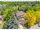 Overhead view of home featuring mature trees and well manicured front yard landscaping with fresh green grass at 1579 W Costilla Pl, Littleton, CO 80120