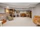 Finished basement featuring carpeted floor, brick fireplace, and neutral walls, ideal for relaxing or entertaining at 1579 W Costilla Pl, Littleton, CO 80120