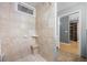 Bright bathroom features tile shower with seat, a tiled soap holder, and a shower window at 1579 W Costilla Pl, Littleton, CO 80120