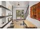 Welcoming foyer with decorative tile flooring, stylish light fixture, and staircase at 1579 W Costilla Pl, Littleton, CO 80120