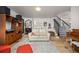 Cozy living room with a piano, staircase, and comfortable seating at 1579 W Costilla Pl, Littleton, CO 80120