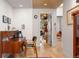 Bright office space with hardwood floors, a wooden ceiling, and modern mid-century furnishings at 1579 W Costilla Pl, Littleton, CO 80120