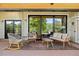 Spacious covered patio with modern outdoor furniture and wood floors, perfect for entertaining guests at 1579 W Costilla Pl, Littleton, CO 80120
