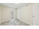 Bedroom featuring neutral paint, carpet, closet and access to ensuite bathroom at 12020 E Canal Dr, Aurora, CO 80011