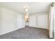 Spacious bedroom with neutral paint, closet, and ensuite bathroom access at 12020 E Canal Dr, Aurora, CO 80011