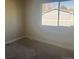 Carpeted bedroom with ample natural light at 12020 E Canal Dr, Aurora, CO 80011