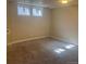 Carpeted bedroom with 2 windows at 12020 E Canal Dr, Aurora, CO 80011