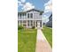 Exterior elevation of home featuring two stories, brick and a manicured lawn at 12020 E Canal Dr, Aurora, CO 80011