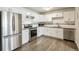 Renovated kitchen with stainless steel appliances and sleek granite countertops at 12020 E Canal Dr, Aurora, CO 80011
