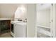 Laundry room featuring modern washer and dryer with access to additional space at 12020 E Canal Dr, Aurora, CO 80011