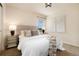 Well-lit bedroom with a comfortable bed, side tables, and modern decor creates a relaxing space at 3027 Walnut Grove St, Erie, CO 80516