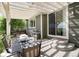 Relax on the covered patio with a dining table, grill, and view of the backyard, perfect for outdoor entertaining at 3027 Walnut Grove St, Erie, CO 80516