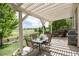 Enjoy outdoor dining under the covered patio with views of the open space, creating a tranquil and inviting atmosphere at 3027 Walnut Grove St, Erie, CO 80516