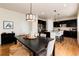 View of dining area featuring a dark wood table, and opens to kitchen at 3027 Walnut Grove St, Erie, CO 80516