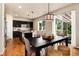 A dining room set in an open floor plan, with access to the back yard at 3027 Walnut Grove St, Erie, CO 80516