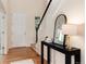 Welcoming foyer features hardwood floors, staircase, and stylish decor, creating an inviting atmosphere at 3027 Walnut Grove St, Erie, CO 80516
