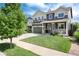 Lovely home boasts green lawn, a welcoming front porch, and a driveway for multiple vehicles, perfect for families at 3027 Walnut Grove St, Erie, CO 80516