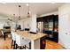 Kitchen island with a granite countertop and barstool seating at 3027 Walnut Grove St, Erie, CO 80516