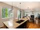 View of a kitchen island with granite countertops at 3027 Walnut Grove St, Erie, CO 80516