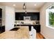 A kitchen with dark cabinets and stainless steel appliances at 3027 Walnut Grove St, Erie, CO 80516