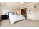 Spacious main bedroom features a barn door leading to the ensuite bathroom and stylish decor at 3027 Walnut Grove St, Erie, CO 80516