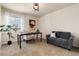 Bright home office features modern decor, comfortable seating, and a large window at 3027 Walnut Grove St, Erie, CO 80516