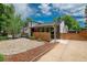 Charming home exterior featuring a modern design, well-maintained landscaping, and inviting entrance at 1650 S Holly St, Denver, CO 80222
