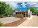 Attractive home exterior with fresh landscaping, stylish fencing, and well-manicured yard at 1650 S Holly St, Denver, CO 80222
