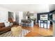 Inviting living room with hardwood floors, open layout, and eat-in dining area at 1650 S Holly St, Denver, CO 80222