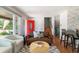 Cozy living room with hardwood floors, modern furniture and eye-catching red front door at 1650 S Holly St, Denver, CO 80222