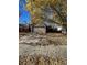 Ranch-style home with two-car garage and mature trees in the front yard at 4063 S Himalaya Way, Aurora, CO 80013