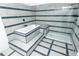Large tiled bathroom with bathtub and separate glass enclosed shower at 7255 E Quincy Ave # 205, Denver, CO 80237