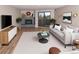 Bright living room features a fireplace, balcony access, and modern decor for a comfortable and stylish space at 7255 E Quincy Ave # 205, Denver, CO 80237