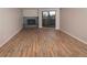 Spacious living room features stylish floors, fireplace, and balcony access for modern comfort and relaxation at 7255 E Quincy Ave # 205, Denver, CO 80237