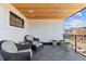 Inviting balcony with wood ceiling, stylish furniture, and city views creates a cozy outdoor living space at 354 Milwaukee St, Denver, CO 80206