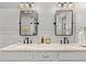 Bathroom with double sinks, marble countertops and modern lighting fixtures at 354 Milwaukee St, Denver, CO 80206