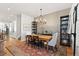 Open concept dining area with hardwood floors, leading into a modern kitchen at 354 Milwaukee St, Denver, CO 80206