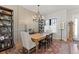 Elegant dining room with modern lighting, decorative shelves, and large wood table at 354 Milwaukee St, Denver, CO 80206