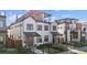 Beautifully designed two story home with white siding, dark windows, and manicured front yard at 354 Milwaukee St, Denver, CO 80206